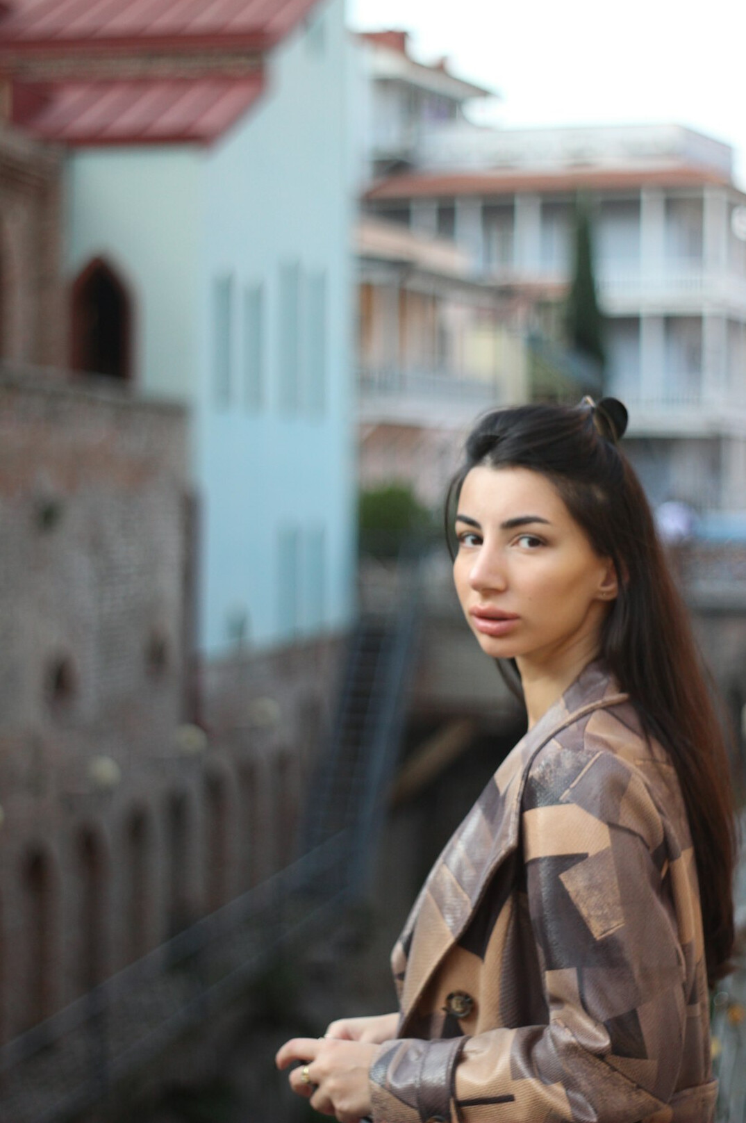 Portrait of a Turkish woman in professional attire smiling at camera